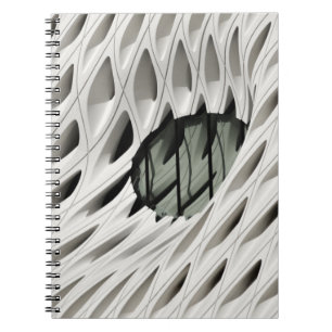 Ovale schwarze Farbglasplatte auf weißer Oberfläch Notizblock