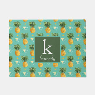 Paillasson Ananas lumineux sur le monogramme géométrique du