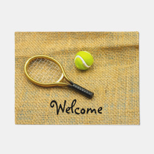 Paillasson Ball de tennis et raquette sur arrière - plan bru
