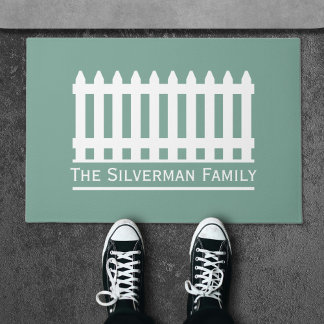 Paillasson Clôture minimaliste blanche sur la famille verte