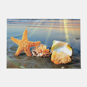 Paillasson Coquillages marins et étoiles de mer sur la plage