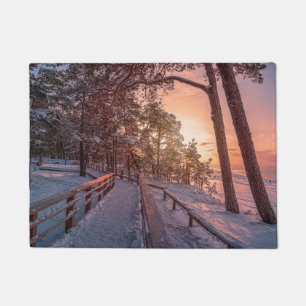 Paillasson Coucher de soleil d'hiver dans une pinède près d