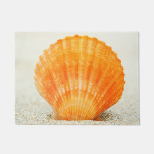 Paillasson Feston Shell orange se tenant droit en sable