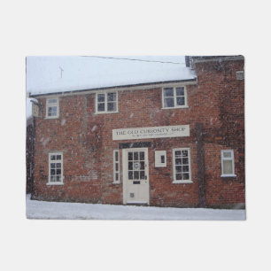 Paillasson l'ancien magasin de curiosité dans la neige noël a
