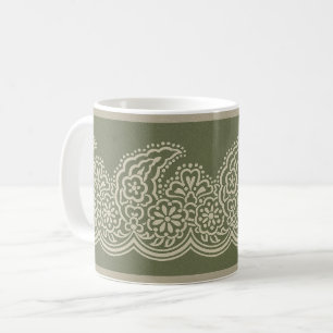 Paisley über die Tasse des grünen Kaffees