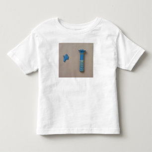 Palmenspalten-Kohl-Flasche und Fragment der Kleinkind T-shirt