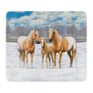 Palomino Appaloosa Pferde im Schnee Schneidebrett