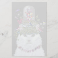 Chat blanc avec cloche à papillon