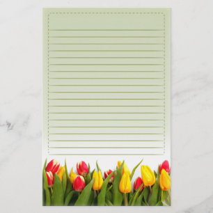Papeterie La tulipe jaune rouge fleurit l'arrière - plan