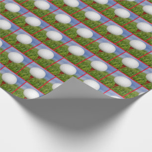 Papier Cadeau balle de golf blanche sur tee rouge