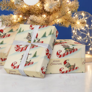 Papier Cadeau Chaton de Noël chevauchant une canne de bonbon