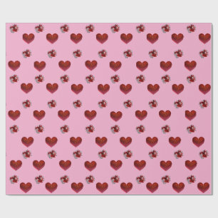 Papier cadeau cœur rouge sur fond rose amour