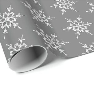 Papier Cadeau Flocons de neige, cristaux argentés sur le gris de