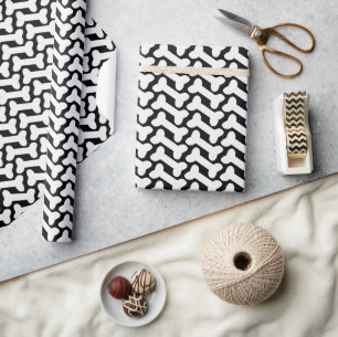 Papier Cadeau Motif os blanc sur coutume noir