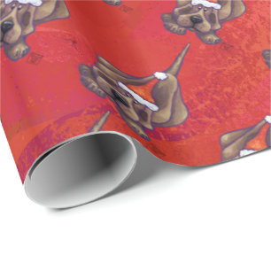 Papier Cadeau Noel de Chien À La Hache Sur Rouge