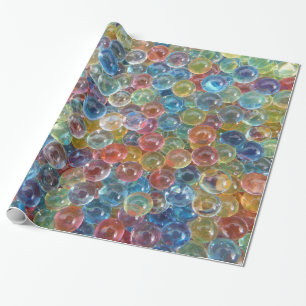 Papier Cadeau perles de verre colorées enveloppant du papier