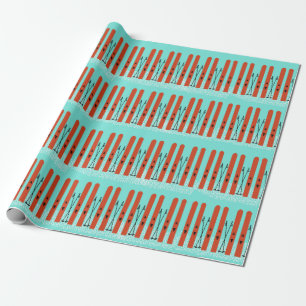PAPIER CADEAU SKIS ROUGE AVEC NEIGE SUR PAPIER EN WRAPPER BLEU