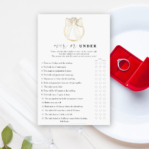 Papier jeu de mariage anneau et arc sur ou sous la robe