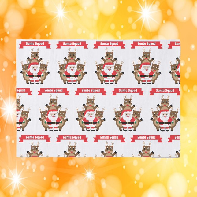 Papier Mousseline Père Noël Squad Noël Drôle Reindeer (Tissue paper with a pattern featuring Santa & his reindeer with a banner that says Santa Squad.)