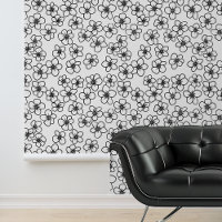 Feuilles noirs de petites fleurs blanches