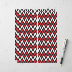 Papier un motif en zigzag rouge et noir sur fond blanc