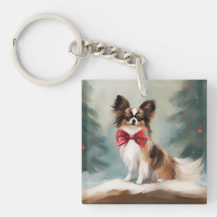 Papillon Chien dans la neige de Noël
