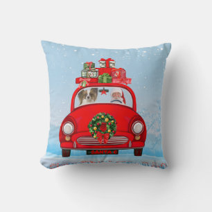 Papillon Dog in Auto mit dem Weihnachtsmann Kissen