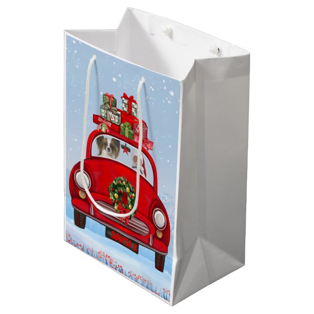 Papillon Dog in Auto mit dem Weihnachtsmann Mittlere Geschenktüte (Vorderseite Schrägansicht)