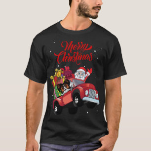Papillon mit dem Weihnachtsmann im roten Lkw-Hund T-Shirt