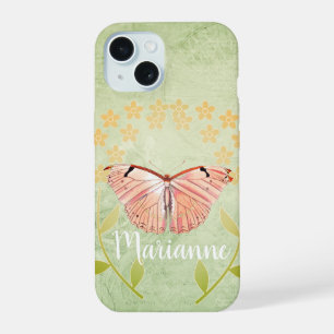Papillon rose sur fond floral vert