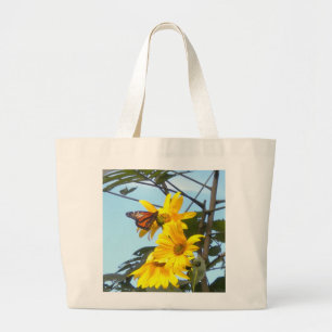 Papillon sur le Sac fourre-tout de tournesol