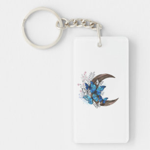 Papillons bleus sur croissant en bois