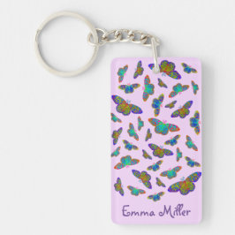 Papillons colorés sur porte - clé rose bébé