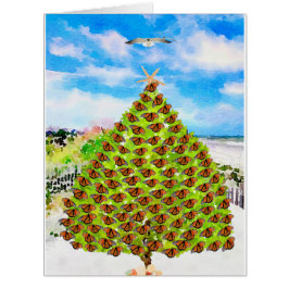 Papillons d'aquarelle et sapin de Noël à la plage