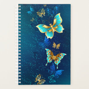 Papillons d'or sur un Arrière - plan bleu