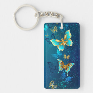 Papillons dorés sur fond bleu