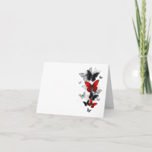 Papillons noirs et rouges volants