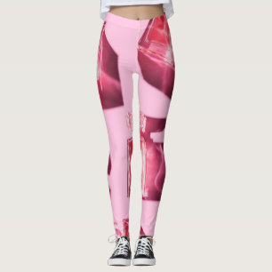 Parfümflaschen, rosa Hintergrund, flach Leggings