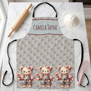 Pastell-Teddybär hält Blume und trägt Overall Schürze