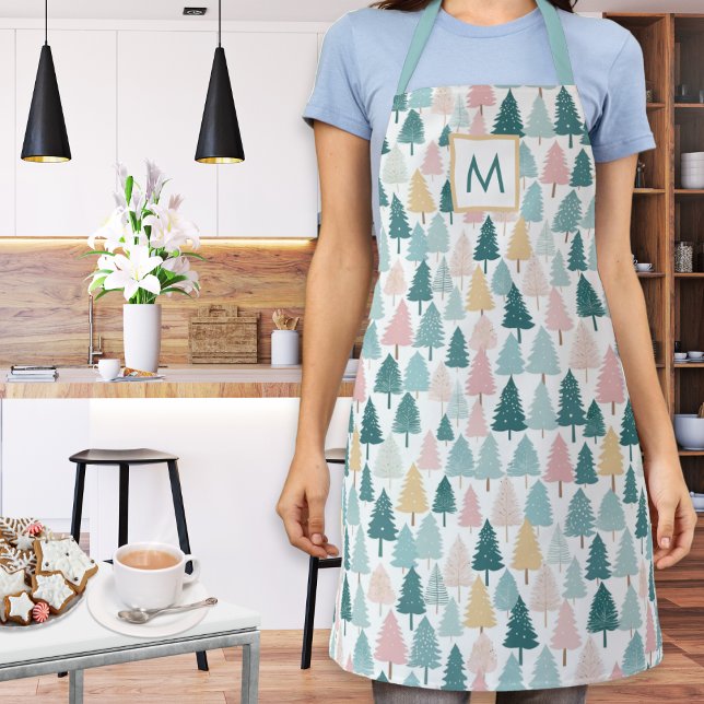 Pastell-Weihnachtsbäume Muster Monogrammierte Küch Schürze (A monogrammed kitchen apron with festive Christmas trees pattern in teal, pink, yellow and white)