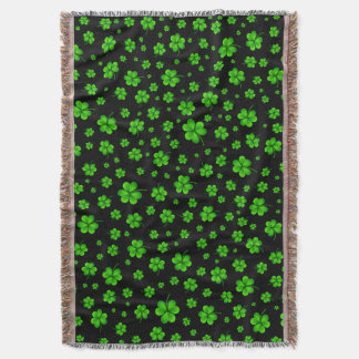 Pattern of green shamrocks on black background decke