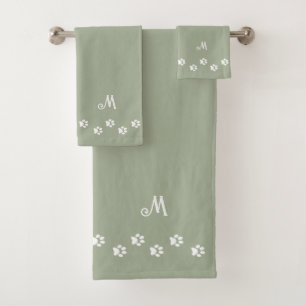 Pattes d'animaux de compagnie et monogramme sur un