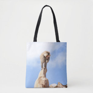Pavianaffe auf einem Berggipfel Tasche