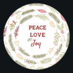 Peace Liebe JoSimple Rustic Christmas Foliage Runder Aufkleber<br><div class="desc">Diese Aufkleber sind ideal für Geschenkverpackungen oder Umschlag Aufkleber und haben eine rustikale Gestaltung von Weihnachtsblättern. Die Formulierung in der Mitte lautet "Peace Liebe and Joy" und ist gerahmt mit Kiefernringen,  Tannenästen,  Weihnachtsschmuck,  Heiligen,  Mistelbeeren und Winterbeeren. Matching Geschenkpackungen und Urlaubskarten sind in unserem Shop erhältlich.</div>