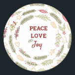 Peace Liebe JoSimple Rustic Christmas Foliage Runder Aufkleber<br><div class="desc">Diese Aufkleber sind ideal für Geschenkverpackungen oder Umschlag Aufkleber und haben eine rustikale Gestaltung von Weihnachtsblättern. Die Formulierung in der Mitte lautet "Peace Liebe and Joy" und ist gerahmt mit Kiefernringen,  Tannenästen,  Weihnachtsschmuck,  Heiligen,  Mistelbeeren und Winterbeeren. Matching Geschenkpackungen und Urlaubskarten sind in unserem Shop erhältlich.</div>