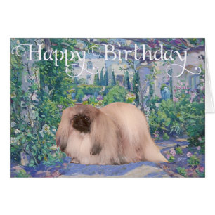 Pekingese im Blumengarten