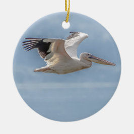 Pelican flying over lake keramik ornament