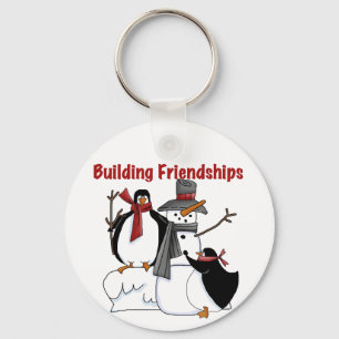Penguins-Gebäude-Freundschafts-T-Shirts und Schlüsselanhänger