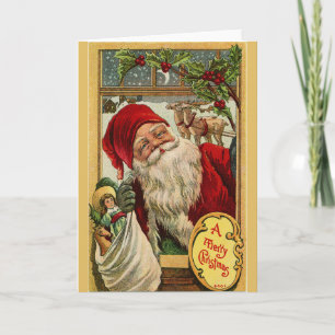 père Noël à la fenêtre avec la carte de voeux pour