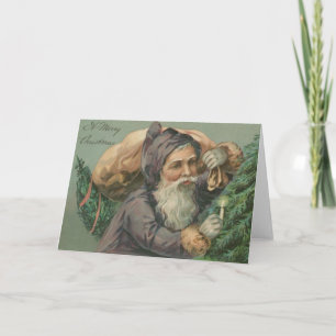 Père Noël avec une carte de Noël de sac